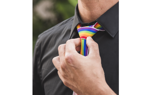 man-with-hand-near-tie-lgbt-colors
